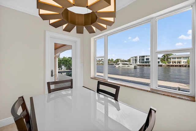 1921 W Terra Mar Dr, Lauderdale By The Sea, FL 33062 - dining area with a water view and ornamental molding