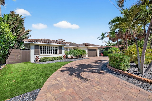 1921 W Terra Mar Dr, Lauderdale By The Sea, FL 33062 - view of front of property featuring stucco siding, a tiled roof, a garage, and decorative driveway