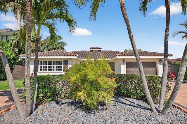 1921 W Terra Mar Dr, Lauderdale By The Sea, FL 33062 - view of front of property with a tiled roof, stucco siding, an attached garage, and driveway