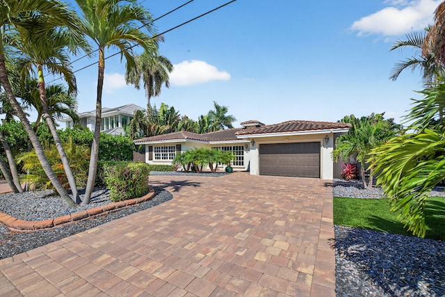 1921 W Terra Mar Dr, Lauderdale By The Sea, FL 33062 - view of front of property with stucco siding, a tiled roof, a garage, and decorative driveway