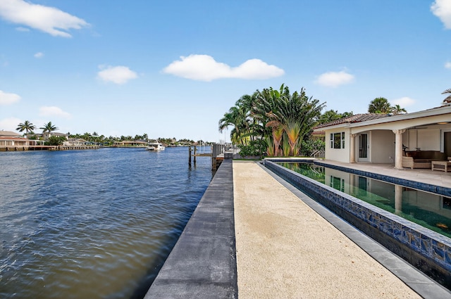 1921 W Terra Mar Dr, Lauderdale By The Sea, FL 33062 - dock with a water view, an infinity pool, and a patio