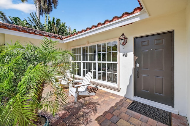 1921 W Terra Mar Dr, Lauderdale By The Sea, FL 33062 - entrance to property featuring a tile roof and stucco siding