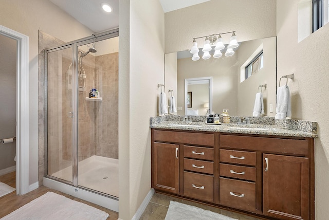 2366 Byron St, Palm Springs, FL 33406 - full bath with a shower stall, tile patterned floors, and double vanity