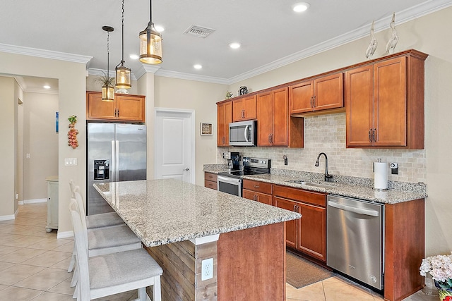 2366 Byron St, Palm Springs, FL 33406 - kitchen featuring stainless steel appliances, light tile patterned floors, light stone counters, decorative backsplash, and a center island
