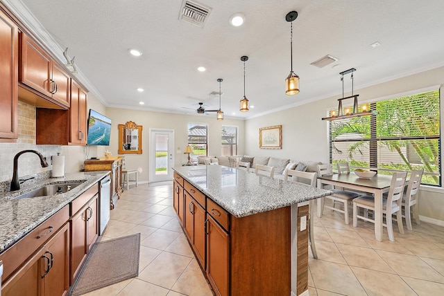 2366 Byron St, Palm Springs, FL 33406 - kitchen featuring light tile patterned floors, recessed lighting, a ceiling fan, crown molding, and a kitchen island
