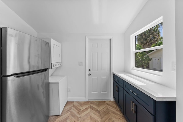 1420 Lake Ave, Lake Worth Beach, FL 33460 - laundry area with stacked washer / dryer and baseboards
