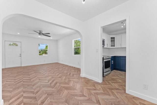 1420 Lake Ave, Lake Worth Beach, FL 33460 - spare room featuring arched walkways, ceiling fan, and recessed lighting