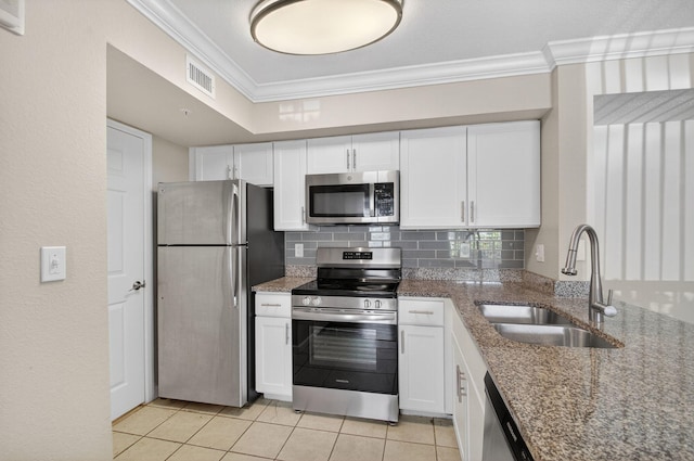 15035 Michelangelo Blvd Unit 105, Delray Beach, FL 33446 - kitchen featuring stainless steel appliances, crown molding, white cabinetry, tasteful backsplash, and light tile patterned flooring