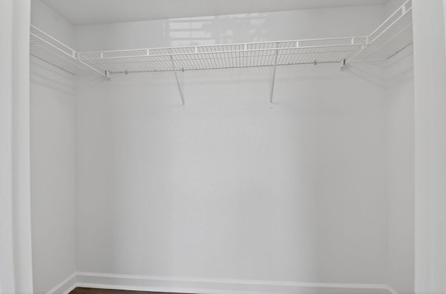 15035 Michelangelo Blvd Unit 105, Delray Beach, FL 33446 - spacious closet featuring dark wood finished floors