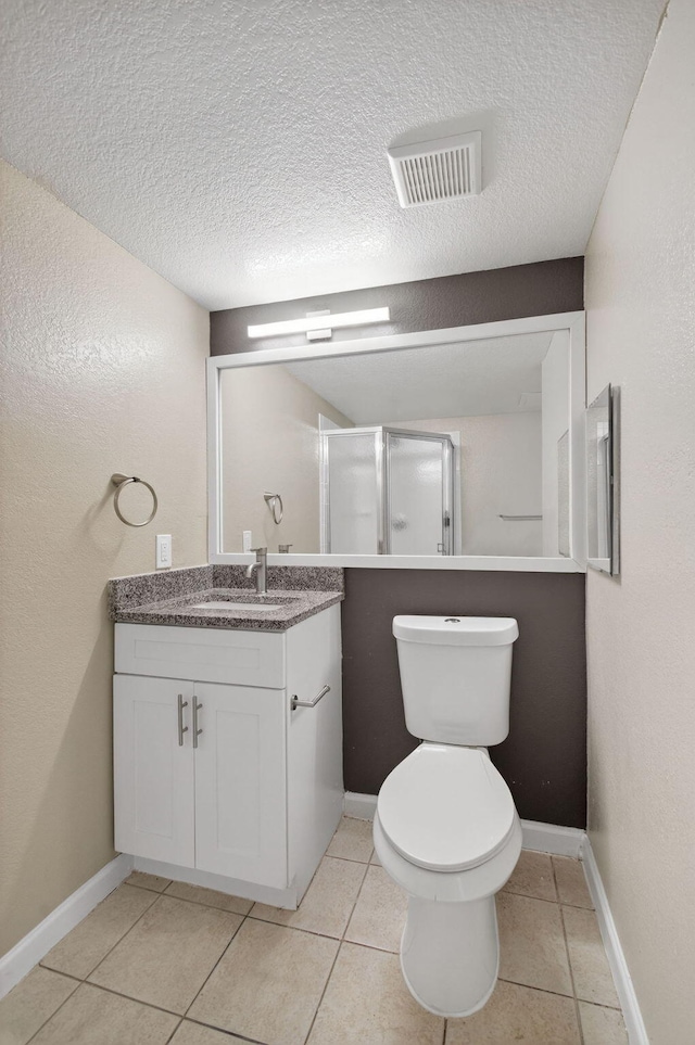 15035 Michelangelo Blvd Unit 105, Delray Beach, FL 33446 - bathroom with vanity, a textured ceiling, a stall shower, and tile patterned flooring