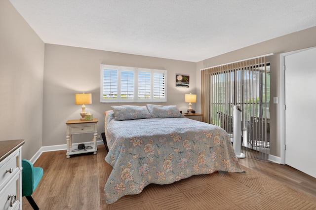 14425 Strathmore Ln Unit 404, Delray Beach, FL 33446 - bedroom featuring wood finished floors and access to outside