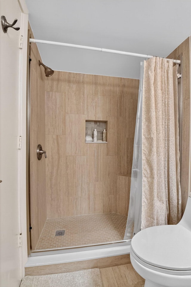 14425 Strathmore Ln Unit 404, Delray Beach, FL 33446 - bathroom featuring a stall shower and toilet