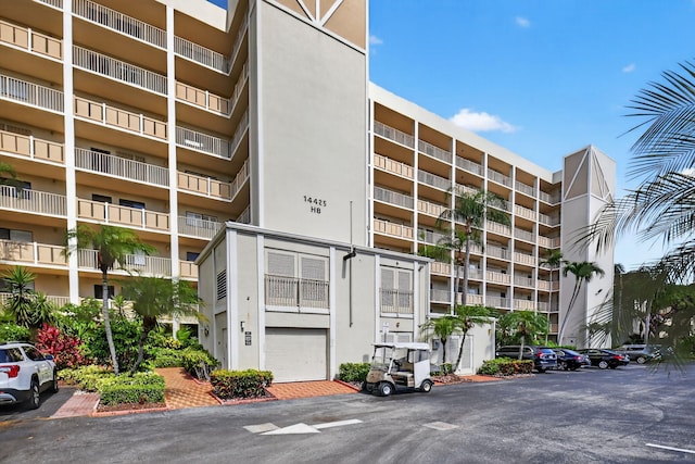14425 Strathmore Ln Unit 404, Delray Beach, FL 33446 - view of apartment building / complex featuring uncovered parking