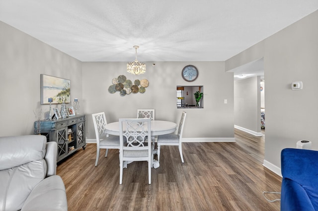 14425 Strathmore Ln Unit 404, Delray Beach, FL 33446 - dining space featuring a chandelier and wood finished floors