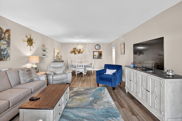 14425 Strathmore Ln Unit 404, Delray Beach, FL 33446 - living room featuring dark wood-style flooring and a chandelier