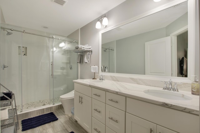 9155 SE Athena St, Hobe Sound, FL 33455 - bathroom with a shower stall and double vanity