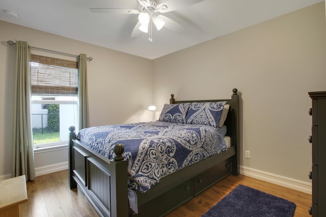 9155 SE Athena St, Hobe Sound, FL 33455 - bedroom with wood finished floors and a ceiling fan