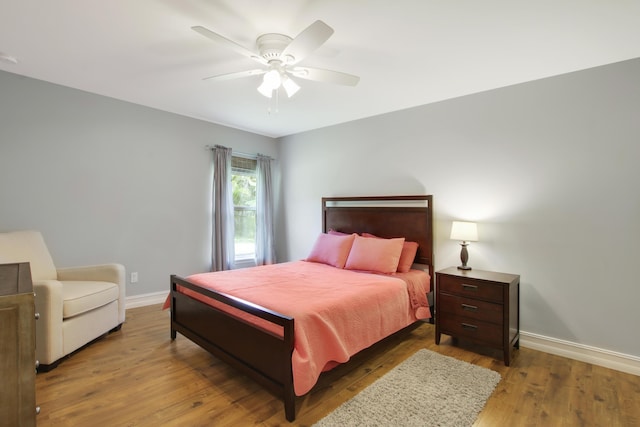 9155 SE Athena St, Hobe Sound, FL 33455 - bedroom featuring wood finished floors and ceiling fan