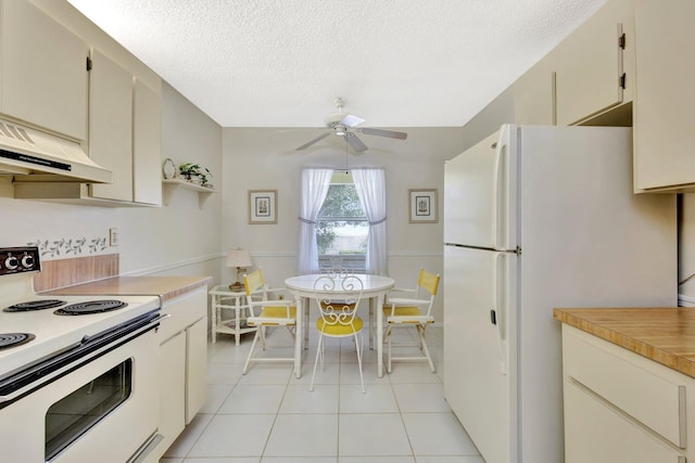 1600 SE Saint Lucie Blvd SE Unit 211, Stuart, FL 34996 - kitchen with white appliances, ceiling fan, light countertops, a textured ceiling, and light tile patterned floors
