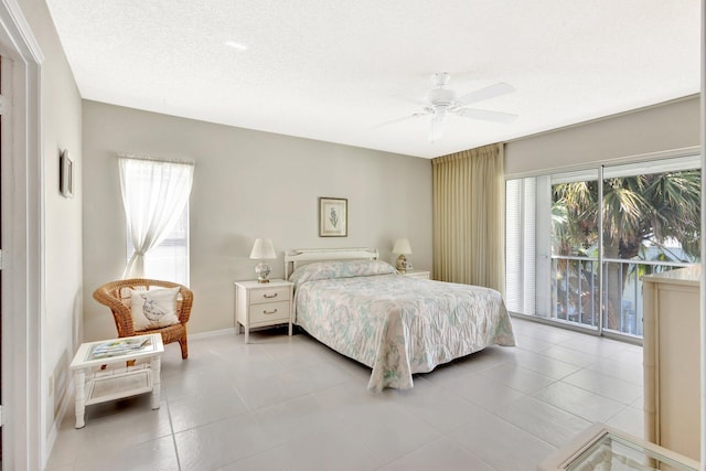 1600 SE Saint Lucie Blvd SE Unit 211, Stuart, FL 34996 - tiled bedroom featuring a ceiling fan and baseboards