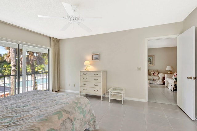 1600 SE Saint Lucie Blvd SE Unit 211, Stuart, FL 34996 - bedroom with tile patterned flooring, access to exterior, and a ceiling fan
