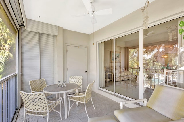 1600 SE Saint Lucie Blvd SE Unit 211, Stuart, FL 34996 - sunroom with ceiling fan and outdoor dining area