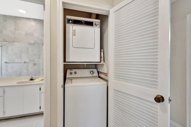 1600 SE Saint Lucie Blvd SE Unit 211, Stuart, FL 34996 - washroom with stacked washer / drying machine