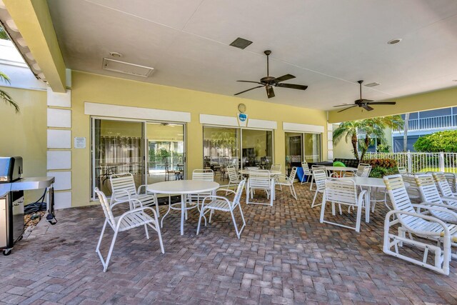 1600 SE Saint Lucie Blvd SE Unit 211, Stuart, FL 34996 - view of patio with outdoor dining space and a ceiling fan