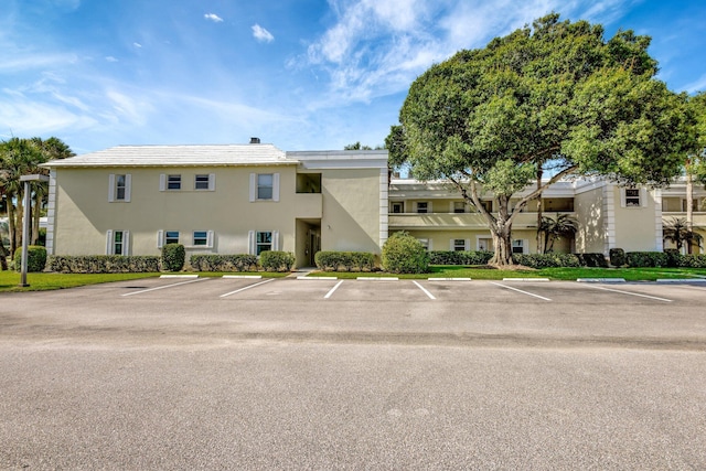 1600 SE Saint Lucie Blvd SE Unit 211, Stuart, FL 34996 - view of property featuring uncovered parking