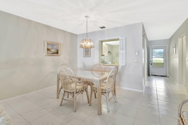 1600 SE Saint Lucie Blvd SE Unit 211, Stuart, FL 34996 - dining room featuring a chandelier and light tile patterned flooring