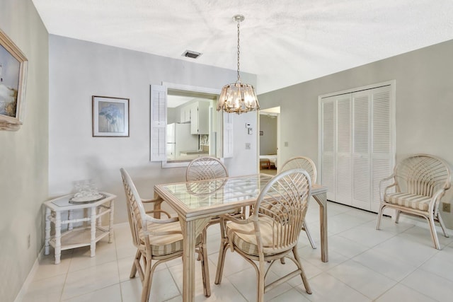 1600 SE Saint Lucie Blvd SE Unit 211, Stuart, FL 34996 - dining area with a chandelier and light tile patterned flooring