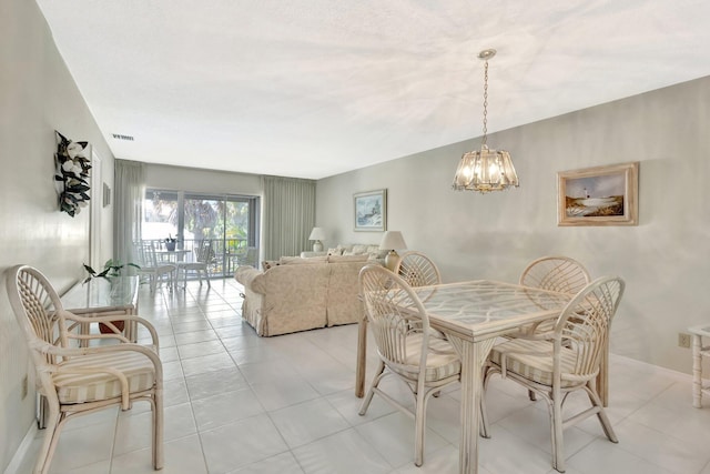 1600 SE Saint Lucie Blvd SE Unit 211, Stuart, FL 34996 - dining room featuring a chandelier