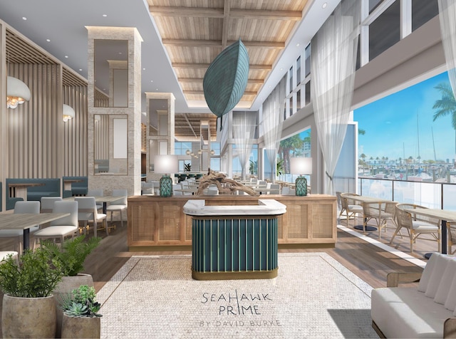 220 Lake Shore Dr Unit 1705, Lake Park, FL 33403 - common area with a towering ceiling and a wooden ceiling with exposed beams