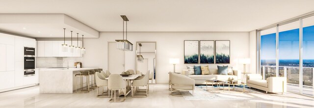 220 Lake Shore Dr Unit 1705, Lake Park, FL 33403 - living room featuring a wall of windows