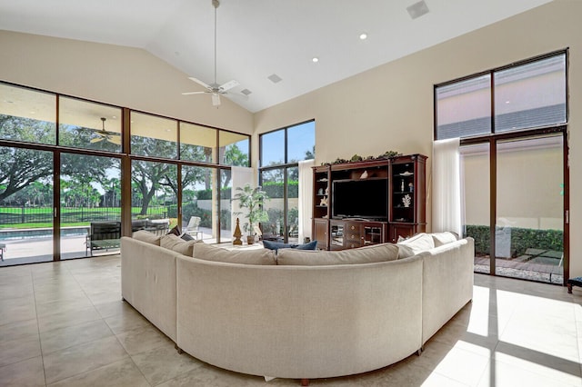 13308 Verdun Dr, Palm Beach Gardens, FL 33410 - living room with a ceiling fan, light tile patterned floors, and high vaulted ceiling