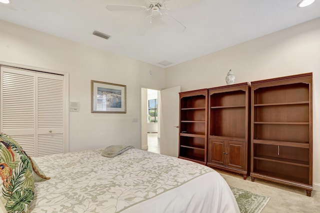 13308 Verdun Dr, Palm Beach Gardens, FL 33410 - bedroom featuring a closet, light carpet, and a ceiling fan