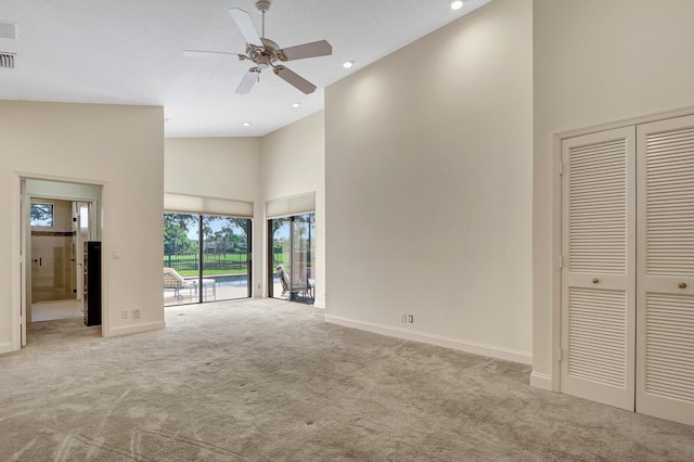 13308 Verdun Dr, Palm Beach Gardens, FL 33410 - unfurnished bedroom featuring high vaulted ceiling, access to exterior, carpet floors, recessed lighting, and a closet