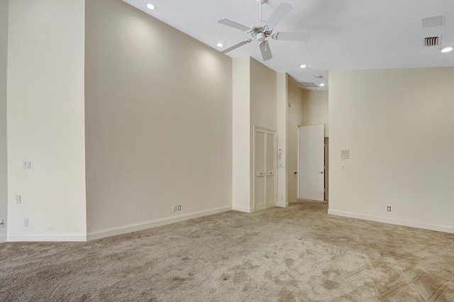13308 Verdun Dr, Palm Beach Gardens, FL 33410 - empty room with carpet, ceiling fan, a high ceiling, and recessed lighting
