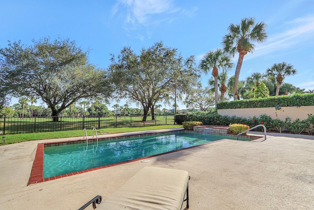 13308 Verdun Dr, Palm Beach Gardens, FL 33410 - view of swimming pool featuring a patio, a fenced backyard, and an in-ground hot tub