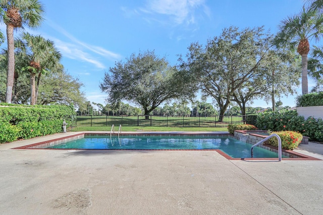 13308 Verdun Dr, Palm Beach Gardens, FL 33410 - view of swimming pool featuring a patio and a fenced backyard