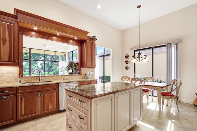 13308 Verdun Dr, Palm Beach Gardens, FL 33410 - kitchen with dishwasher, tasteful backsplash, light stone countertops, and a ceiling fan
