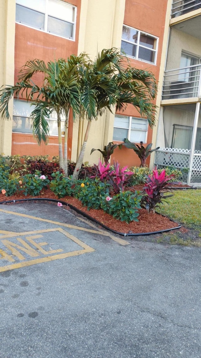 3710 NW 21st St Unit 214, Lauderdale Lakes, FL 33311 - view of property featuring uncovered parking