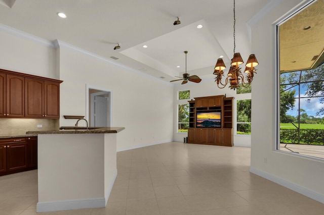 8732 Bally Bunion Rd, Port Saint Lucie, FL 34986 - kitchen with dark stone counters, a chandelier, backsplash, recessed lighting, and pendant lighting