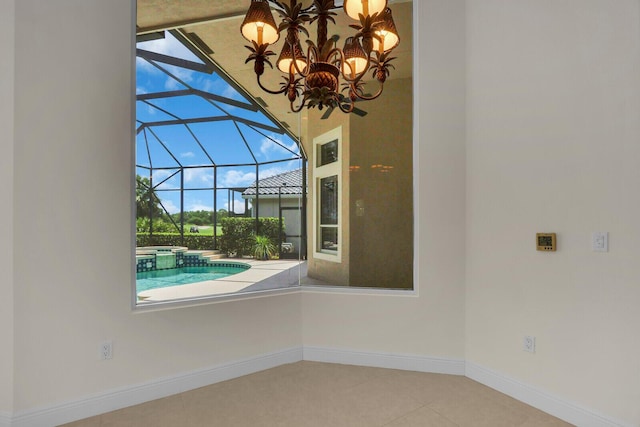 8732 Bally Bunion Rd, Port Saint Lucie, FL 34986 - unfurnished room featuring a sunroom, tile patterned flooring, and a chandelier