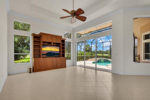 8732 Bally Bunion Rd, Port Saint Lucie, FL 34986 - unfurnished living room featuring a sunroom, ceiling fan, light tile patterned flooring, and a towering ceiling