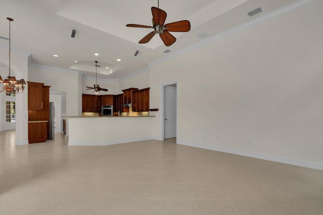 8732 Bally Bunion Rd, Port Saint Lucie, FL 34986 - unfurnished living room featuring crown molding, a ceiling fan, a chandelier, recessed lighting, and a raised ceiling