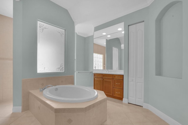 8732 Bally Bunion Rd, Port Saint Lucie, FL 34986 - bathroom featuring a bath, vanity, tile patterned flooring, and a closet