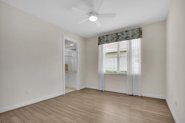 8732 Bally Bunion Rd, Port Saint Lucie, FL 34986 - spare room with light wood finished floors and a ceiling fan