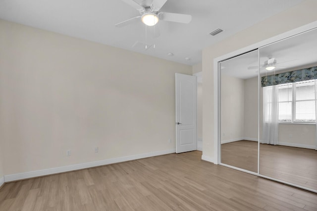 8732 Bally Bunion Rd, Port Saint Lucie, FL 34986 - unfurnished bedroom featuring wood finished floors, a closet, and ceiling fan