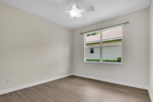8732 Bally Bunion Rd, Port Saint Lucie, FL 34986 - empty room with wood finished floors and ceiling fan